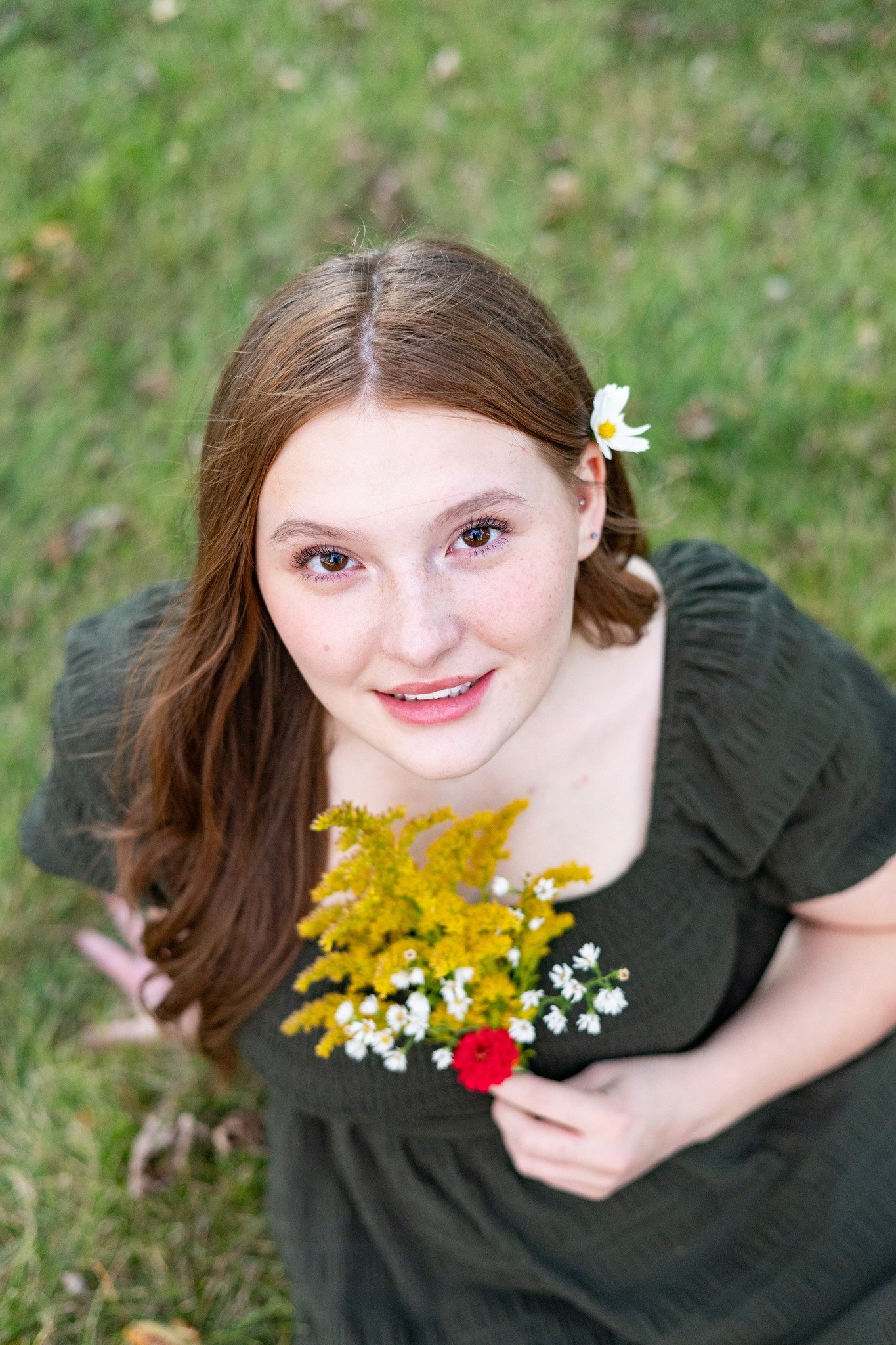 top view of a woman holding flowers