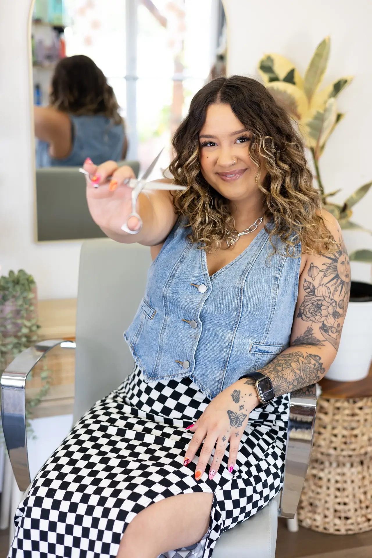 woman posing with scissors in hand